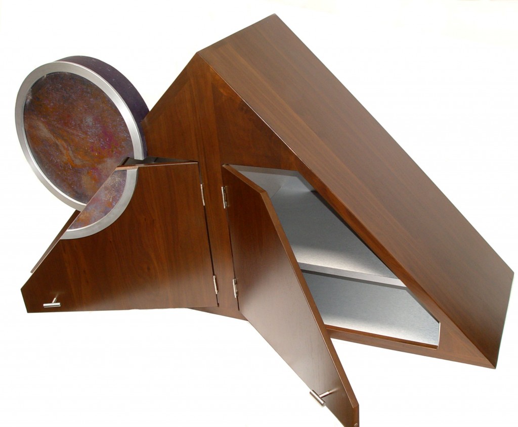 Walnut and stainless steel kitchen cabinet with a circular abstract art painting.
